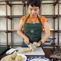 Prepping ingredients fresh from Doing Ba market  at An Nhien Garden in Hue