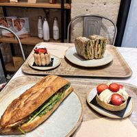 bhan mi baguette and a umami sandwich, strawberry tartlette and unsure of the other ones name  at Land & Monkeys - Amsterdam in Paris