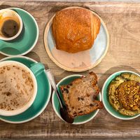 Espresso, chai latte, pain au chocolate, banana bread, pistachio cookie  at Land & Monkeys - Amsterdam in Paris