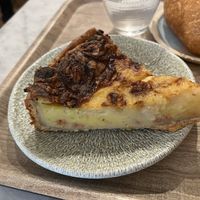 Quiche lorraine - she heated it up for like 30 seconds and it made it feel stale - better to be eaten completely cold or warm - texture was too chewy and crust was not flaky  at Land & Monkeys - Amsterdam in Paris