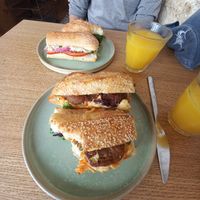 Baguette sandwiches and orange juice. at Land & Monkeys - Amsterdam in Paris