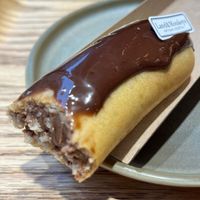 A decadent vegan eclair with chocolate. at Land & Monkeys - Amsterdam in Paris