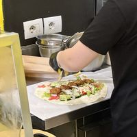 Falafel wrap being made   at Falafel House in Tirana