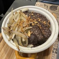 Ración de patatas confitadas con morcilla vegana  at Acherito in Jaca