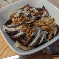 Patatas confitadas con morcill vegana y cebolla pochada (muy recomendable) at Acherito in Jaca