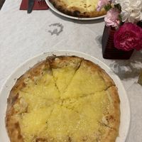 Vegan cheese garlic bread (non vegan version in background)  at Trattoria in Bowness-on-windermere