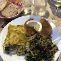 Lasagna, seitan cutlets and mixed greens  at La Cucina Dei Colori in Catania