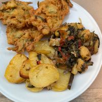 A 3 Meal combo with chickpea fritters, gnocchi and baked potato’s  at La Cucina Dei Colori in Catania