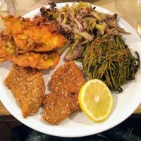 Broccoli cream spaghetti pie, seitan cutlets, chickpea flour & vegetable fritters, drunken cauliflower. at La Cucina Dei Colori in Catania