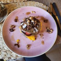 Buckwheat pancakes with strawberries, mango, candied nuts at Noranta Tres in Escaldes-engordany