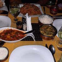 Vegan dishes on the table: cashew cream curry with vegetables (right) and triple Szechuan fried rice (top). Both spectacular! at Amber Restaurant in Arusha