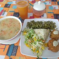 Veggie soup. Green beans, tropical salad, rice, soy meatballs. at Gira El Sol in Pasto