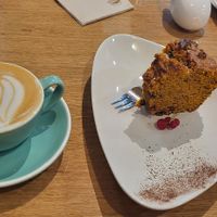 Flat white with oat milk and vegan carrot cake at Art Food Corner in Funchal