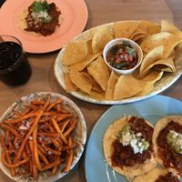 Sweet potato fries, cactus salad with corn chips and soft tacos at Tres in Stockholm