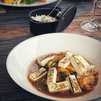 Tofu with vegetable jus - shitake, daikon, shimeji
 and burger with curry at Avista Restaurant in Funchal