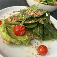 avocado toast and a side salad   at Café Janis in Lisbon