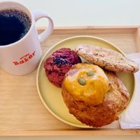 A pumpkin muffin, a caramel tea cookie, and a purple sweet potato scokie and a black coffee  at Ovgo B.A.K.E.R Edo St in Tokyo
