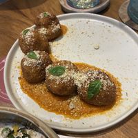 Bland arancini with a delicious sauce  at NIYA in Casablanca