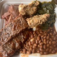“Ribs”, “pulled pork,” “chicken tender” bbq plate with baked beans and collard greens  at Your Local Seitanist in Chattanooga
