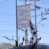 Unobtrusive sign, watch for turn carefully  at Your Local Seitanist in Chattanooga