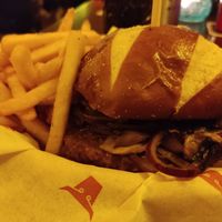 Magic mushroom truffle and Swiss vegan burger with fries at The Tavern in Prague