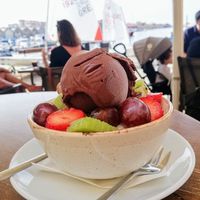 Fruit salad with vegan ice cream on top (chocolate) at Istioploikos Sea Lounge in Crete