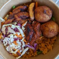 Jollof rice with plantain and yam balls at Veghana in Dubai