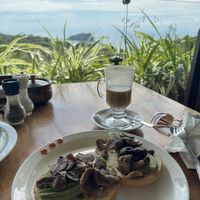 Asked for bagel with avocado and mushrooms. Almond latte. Delicious!  at Emilio's Cafe in Aguirre