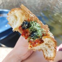 Olives, tomato, vegan parm at Margo's Amsterdam - Jordaan in Amsterdam