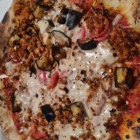  at Unique (V) Pizzeria SUKHASANA in Osaka