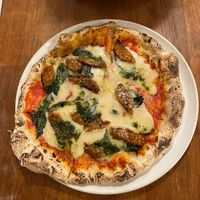   at Unique (V) Pizzeria SUKHASANA in Osaka