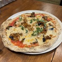   at Unique (V) Pizzeria SUKHASANA in Osaka