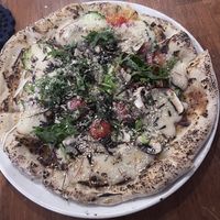   at Unique (V) Pizzeria SUKHASANA in Osaka