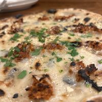   at Unique (V) Pizzeria SUKHASANA in Osaka