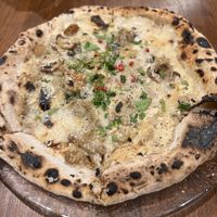   at Unique (V) Pizzeria SUKHASANA in Osaka