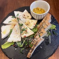 Smoked tofu  at Unique (V) Pizzeria SUKHASANA in Osaka