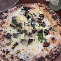 Smoked tempeh pizzaa  at Unique (V) Pizzeria SUKHASANA in Osaka