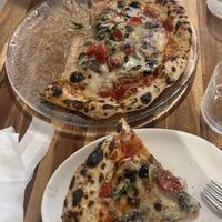   at Unique (V) Pizzeria SUKHASANA in Osaka