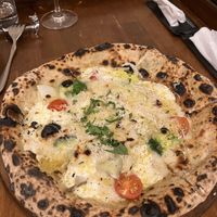  at Unique (V) Pizzeria SUKHASANA in Osaka