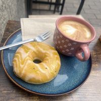 Glazed doughnut with kiwi and an oat milk cappuccino! 😍  at Donuthek in Paderborn