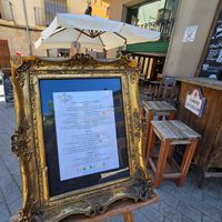 Menu in nice frame on street at La Vermuteria in Solsona