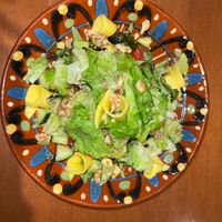 Amazing salad with fresh greens, mango cucumber, avocado, walnuts.  Very well, dressed with a clean dressing. My body feels amazing after eating this salad. at La Vermuteria in Solsona