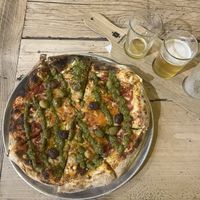 Pesto e olive pizza, selection of 1/3 pints (all vegan too!)  at Thornbridge Brewery Taproom in Bakewell