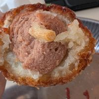 Sausage corn dog filling at GangNam Falafel in Paris