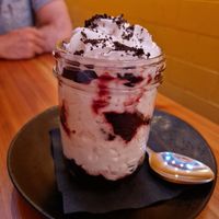 Gf brownie with coconut whip and cherries at Whitetooth Mountain Bistro  in Golden