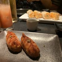 Shitaki bacon inari and baked crab roll. Both were so good!  at PLANTA Queen in New York City