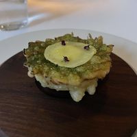 Artichoke heart prepared with many ingredients I have never heard of. Delish   at Eleven Madison Park in New York City