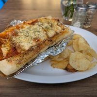 Seitan chicken parm with default side of chips at Subculture Vegan Deli & Provisions  in Albany