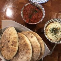 The fluffiest pita with spicy tahini and madbukha  at Mazal in Los Angeles