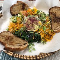 Sharing platter with homemade kimchi, tofu, spinach and cashew cheese rolls, avocado at Cultiva Pizza Shop - Greenhouse Restaurant in Nairobi